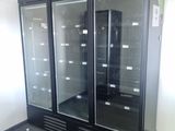 two glass doors that are open in a room