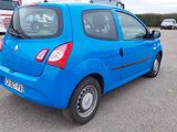 a blue car that is parked in a parking lot