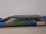 a stack of books sitting on top of a wooden table