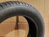 a close up of a tire on a cardboard box with a cardboard box in the background