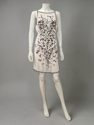 a mannequin dress with black and white flowers on a mannequin