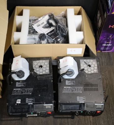two boxes of electronic equipment sitting on the floor