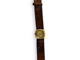 brown leather watch strap with a gold plated watch face