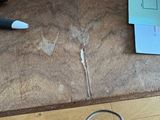a pair of scissors and a pair of scissors on a table