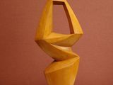 a wooden sculpture that is sitting on a table