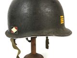 an image of a helmet on a wooden stand on a white background