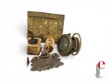 an image of a group of objects including a clock, a box, and other items
