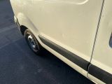 a white van parked on the side of the road