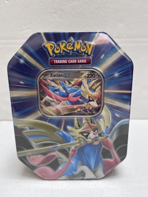 a close up of a pokemon trading card game in a tin