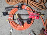 a bunch of hoses that are laying on the ground