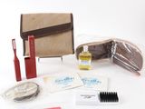 a purse, toothbrush, toothpaste, toothpaste, and other items that are on the table