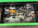 a green box with a bunch of tools inside of it