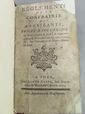 an old book that is open on a table