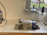 a sewing machine sitting on a table in a room
