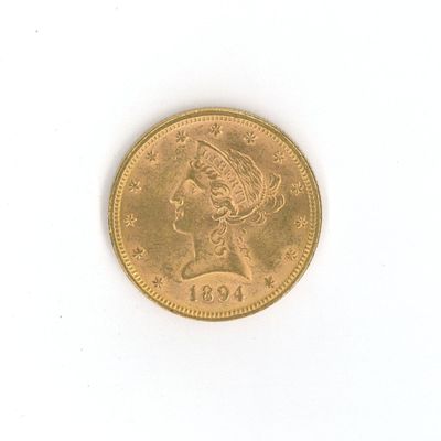 une pièce d'or sur laquelle est représentée la tête d'une femme