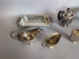 silver plated items including a teapot, saucer, spoon, and other items