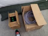 a box with a hose and a box with a hose on the floor