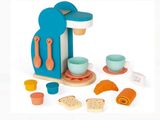 a toy kitchen set with a toaster and cups