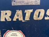 a close up of a metal box with a sticker on it
