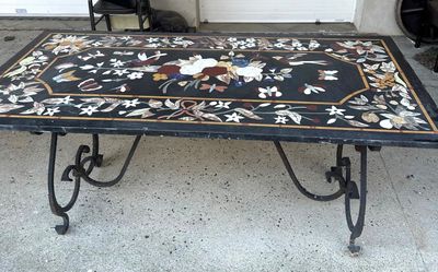 a black table with a floral design on it