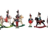 a group of figurines of soldiers on a white background