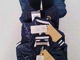 a pile of clothing that is on display on a table