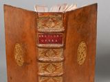 an old book that is open on a table