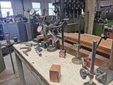 a workbench with tools on it in a workshop