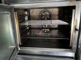 an open oven that is sitting inside of a kitchen