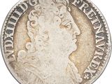a silver coin with a portrait of a woman on it