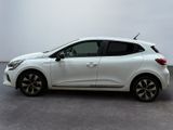 the white car is parked on the concrete floor in the room