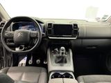 the interior of a car with a steering wheel, dashboard, and dashboard controls