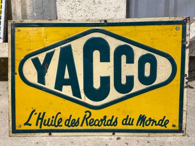 a yellow and green sign that says yacco