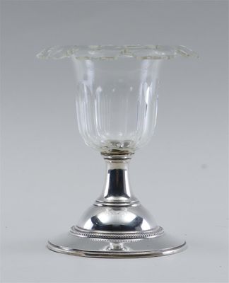 silver plated wine glass with raised stem and raised base