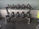 a rack of dumbs in a gym room with other dumbs