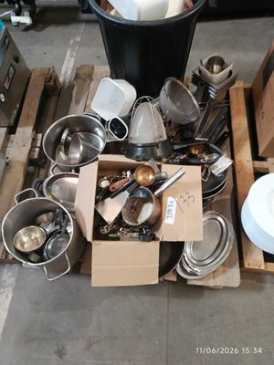 a pile of silverware sitting on top of a pallet
