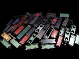 a lot of old train parts on a black background