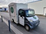 an image of a delivery truck parked on the side of the road