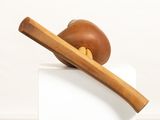 a wooden object that is on top of a block