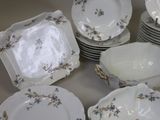a lot of plates that are sitting on a table