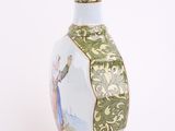 a vase with a picture of a woman on it