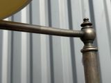 a close up of a metal pole with a clock on it