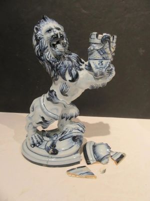 a figurine of a lion on a table