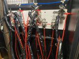 a bunch of hoses that are connected to a wall
