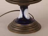 a blue and white lamp that is sitting on a table
