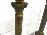 two vases sitting next to each other on a table
