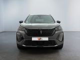 the front view of a grey car in a showroom