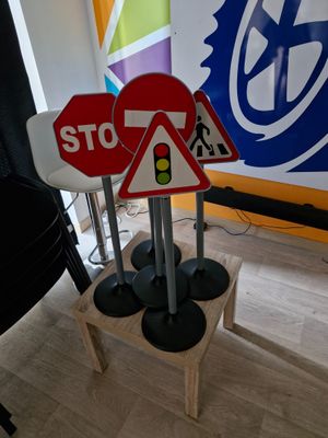 a stop sign and a traffic sign on a wooden stand