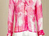 the mannequin is wearing a pink shirt with a tie on it