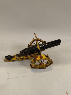 une image représentant un pistolet jouet posé sur une surface blanche